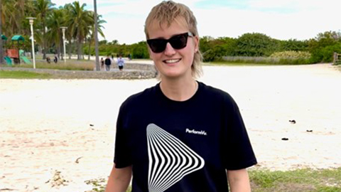 Indy Sanders smiling wearing a tshirt with PerformVu's Logo on it
